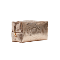 Impressive gold cosmetic bag for storing cosmetics and accessories.